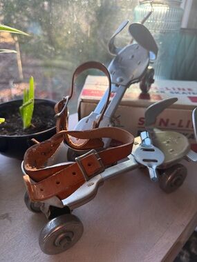 Crescent Tan Leather Strap Adjustable Metal Roller Skate Set